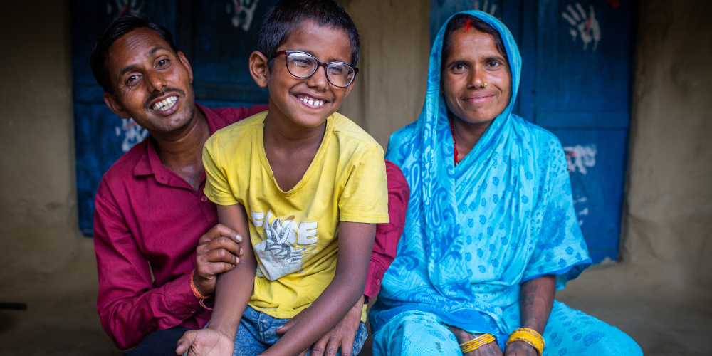 correction with the pair glasses brought back the happiness of family. See how the family is cheering with his son's improved vision.